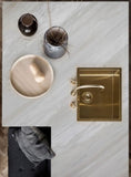 Ajax Gold natural marble slab with honed finish, showcasing soft gold and beige veining on a light neutral background—ideal for elegant countertops, flooring, and wall applications.