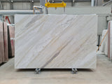 Ajax Gold natural marble slab with honed finish, showcasing soft gold and beige veining on a light neutral background—ideal for elegant countertops, flooring, and wall applications.
