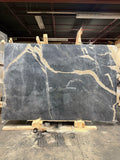 Golden Root natural marble slab with polished finish, 75-inch by 110-inch (57.29 sq. ft.), featuring warm gold and beige veining on a creamy background—perfect for luxury countertops and interior surfaces.