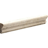 Ivory Honed Andorra Travertine molding with sculpted curve from Sapphirus Stone Toronto. Ideal for backsplash caps, trim edges, and wall accents.